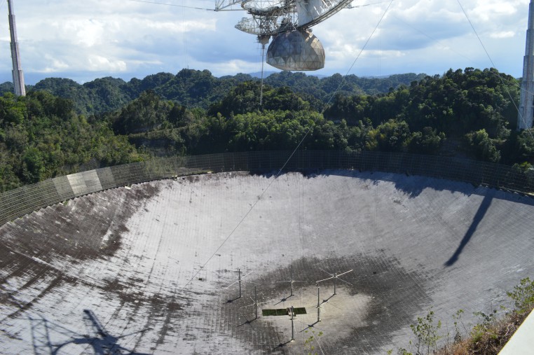 The large radio dish of the Arecibo Observatory