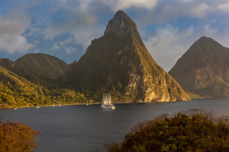 View of Pitons and a sailing ship in St. Lucia