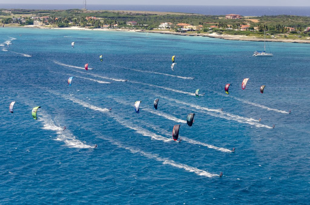 Malmok beach in Aruba full of kite surfers