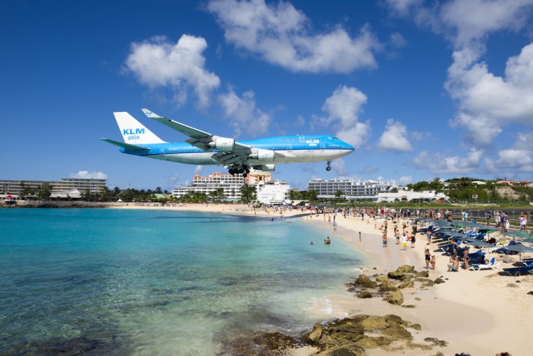 KLM plane flying over Maho Beach in St. Marteen