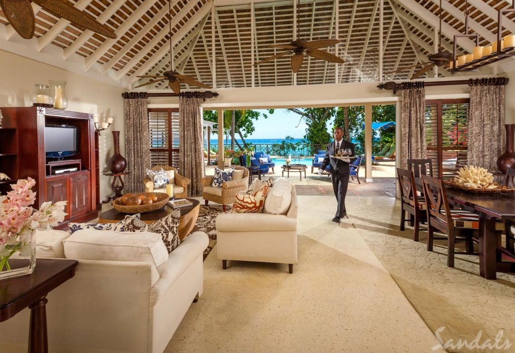 Butler providing service in a building at Sandals Royal Plantation